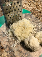 Shred cauliflower with box grater.